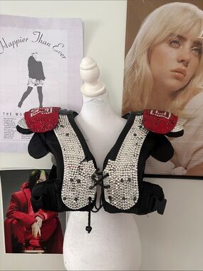 Rhinestoned REAL football pads, designed after Chappell Roan’s football costume